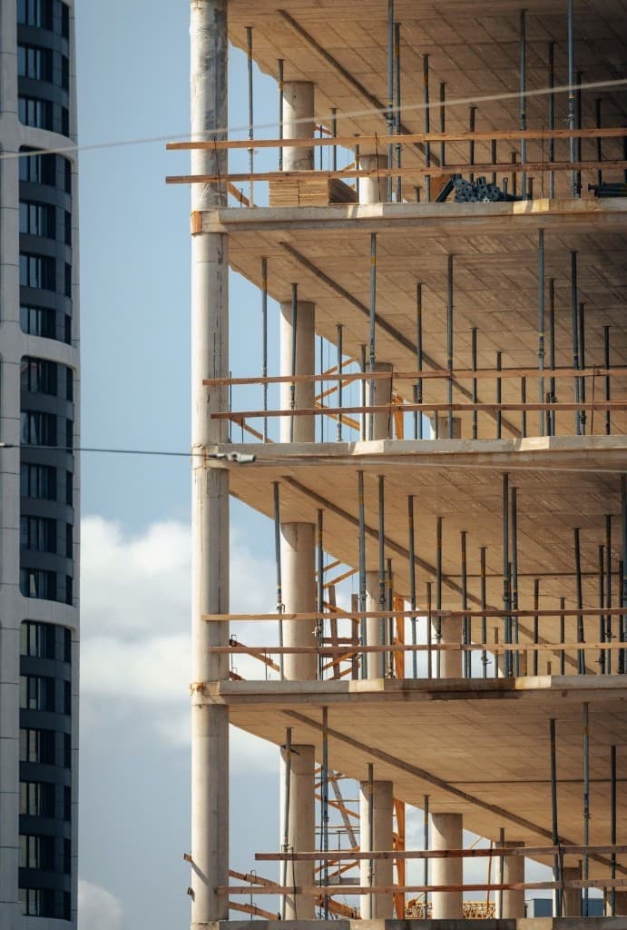 Concrete floors with shoring posts during high-rise construction